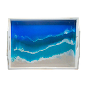 white wood serving tray with handles and ocean background